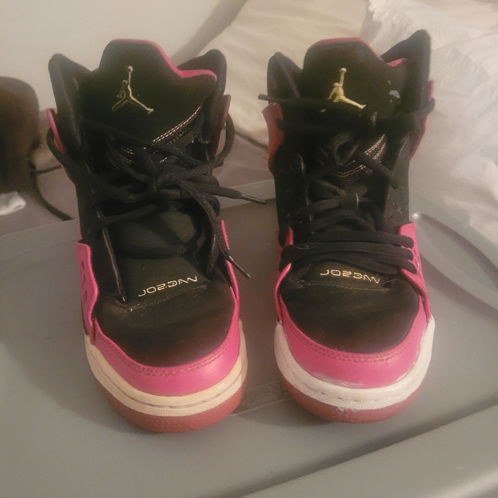 Pink and  black Jordan's